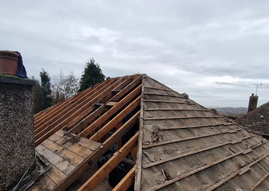 Roofers working on a pitched roof